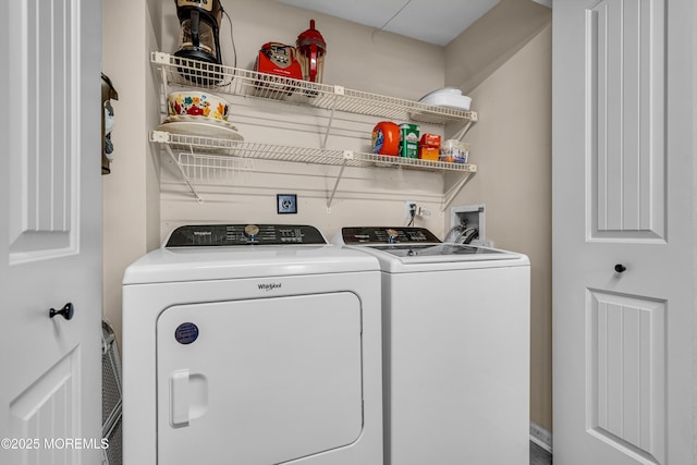 laundry room with separate washer and dryer