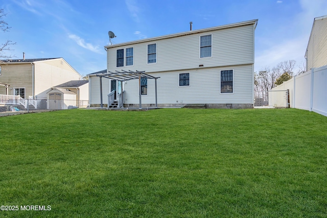 back of house with a yard and a pergola