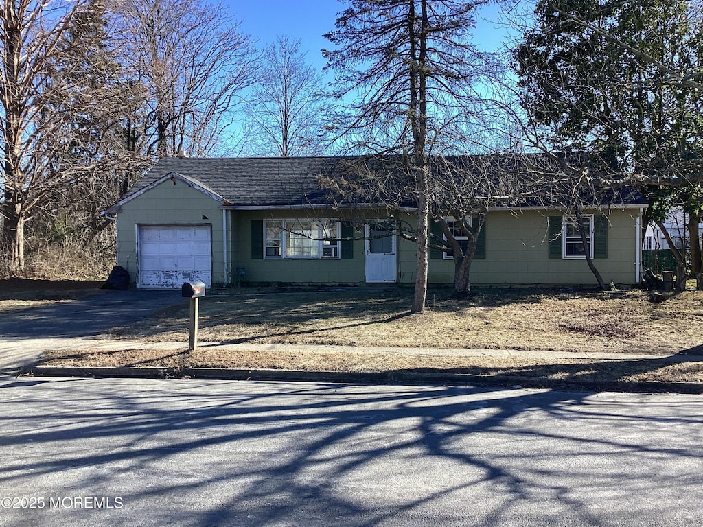 single story home with a garage