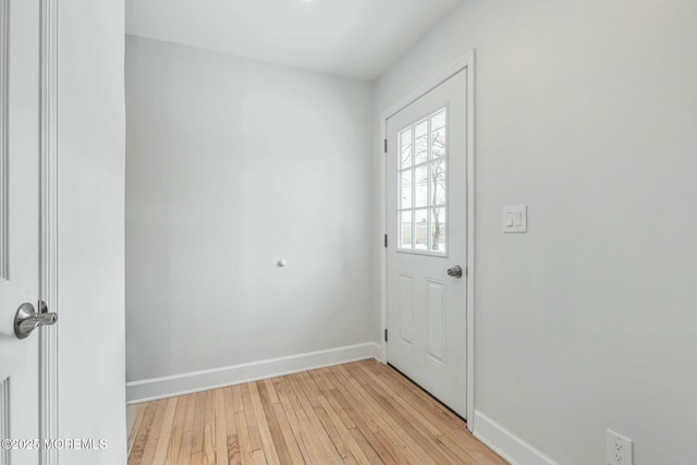 doorway to outside with light wood-type flooring