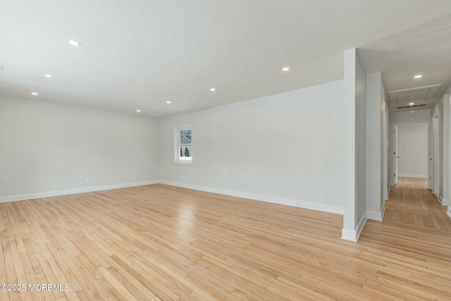 empty room with light hardwood / wood-style floors