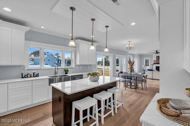 302 Reef Ct, Forked River, NJ 08731 - kitchen with dishwasher, a kitchen breakfast bar, white cabinetry, a chandelier, and recessed lighting