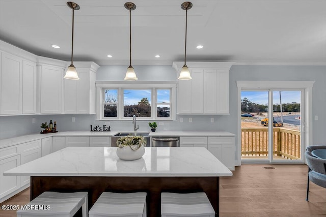 302 Reef Ct, Forked River, NJ 08731 - kitchen featuring stainless steel dishwasher, a kitchen breakfast bar, white cabinetry, hanging light fixtures, and light stone countertops