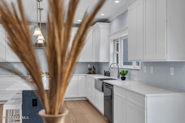 302 Reef Ct, Forked River, NJ 08731 - kitchen with stainless steel dishwasher, white cabinets, light wood finished floors, light stone counters, and pendant lighting