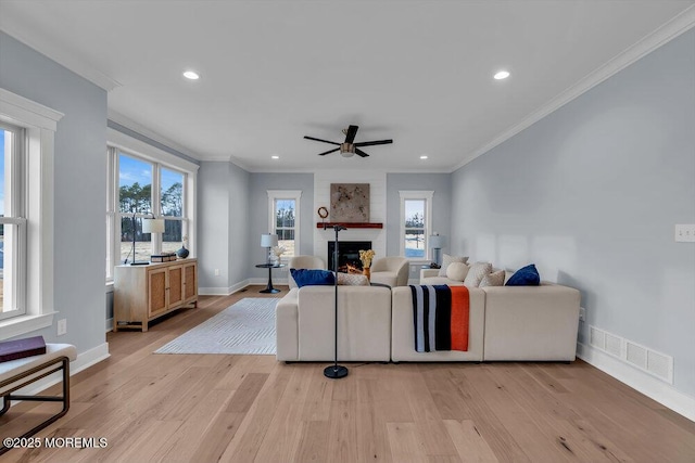 302 Reef Ct, Forked River, NJ 08731 - living area with ceiling fan, light wood finished floors, a large fireplace, crown molding, and recessed lighting