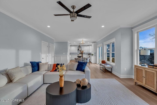 302 Reef Ct, Forked River, NJ 08731 - living room with crown molding, ceiling fan, light wood-style flooring, recessed lighting, and a chandelier