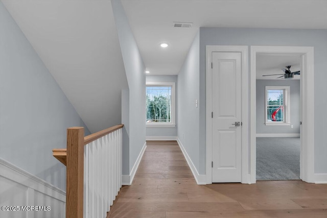 302 Reef Ct, Forked River, NJ 08731 - hallway with an upstairs landing, plenty of natural light, wood finished floors, and recessed lighting