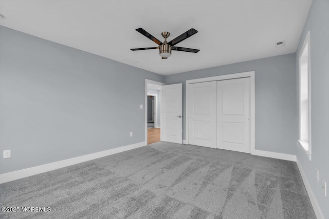 302 Reef Ct, Forked River, NJ 08731 - unfurnished bedroom with a closet, carpet, and ceiling fan