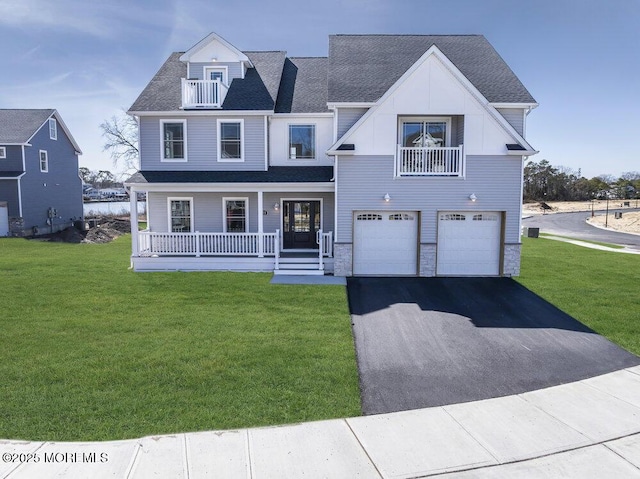 302 Reef Ct, Forked River, NJ 08731 - view of front of house with a balcony, covered porch, an attached garage, asphalt driveway, and a front yard