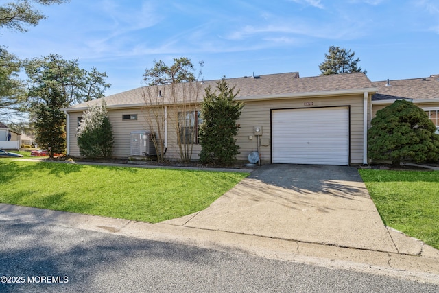 ranch-style home with a garage and a front yard