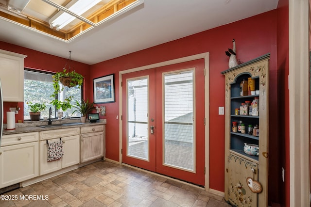 doorway with sink and french doors