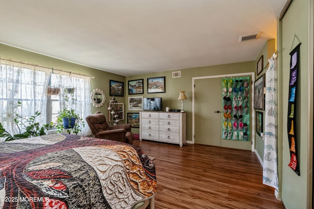 bedroom featuring dark hardwood / wood-style floors