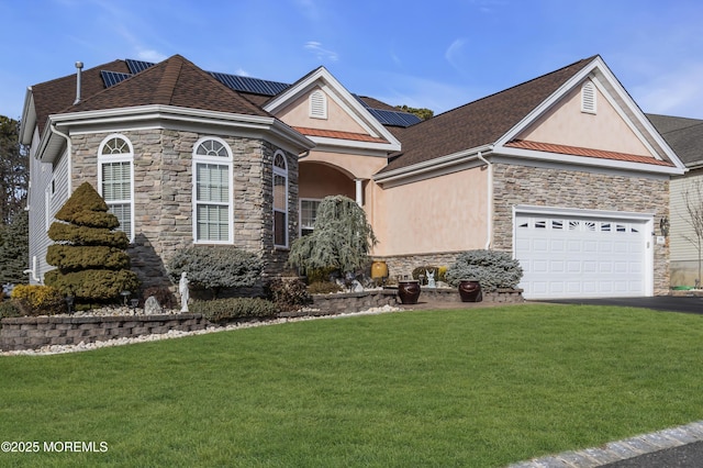 view of front of house with a garage and a front yard