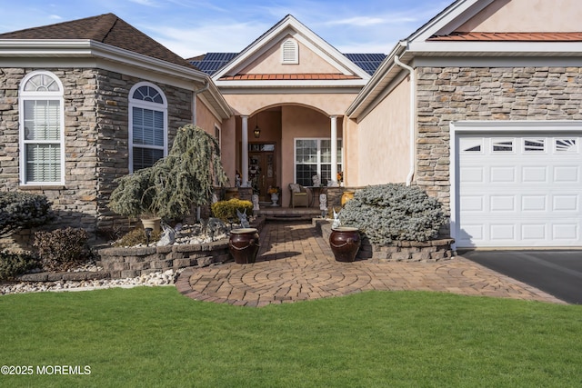 view of front of property featuring a garage and a front yard