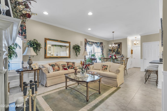 living room with ornamental molding and a notable chandelier