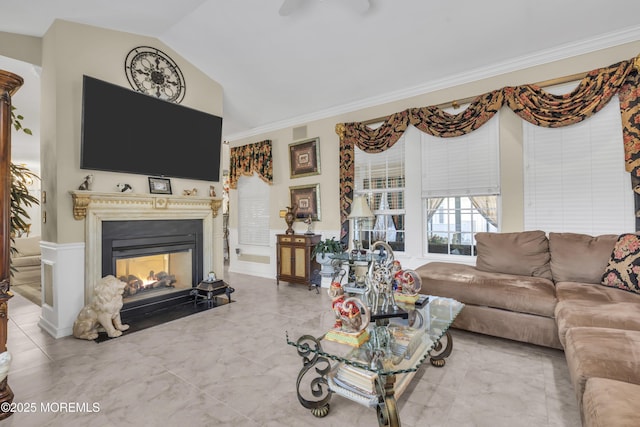 living room featuring ornamental molding and lofted ceiling