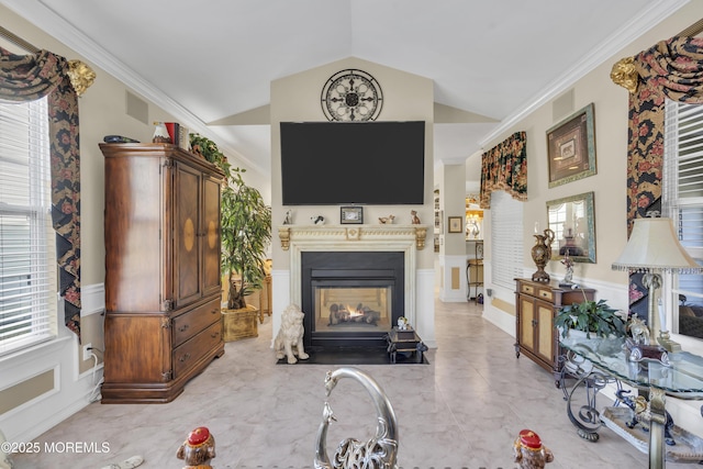 living room with vaulted ceiling and crown molding