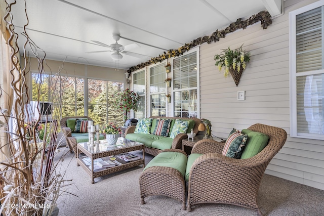 sunroom / solarium with beam ceiling and ceiling fan