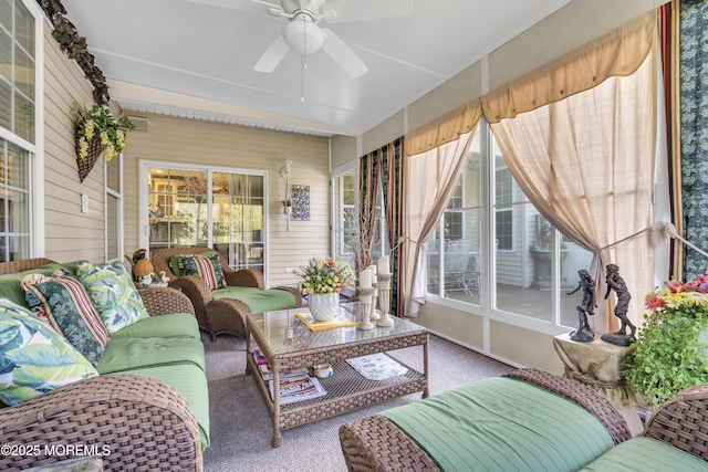 sunroom featuring ceiling fan