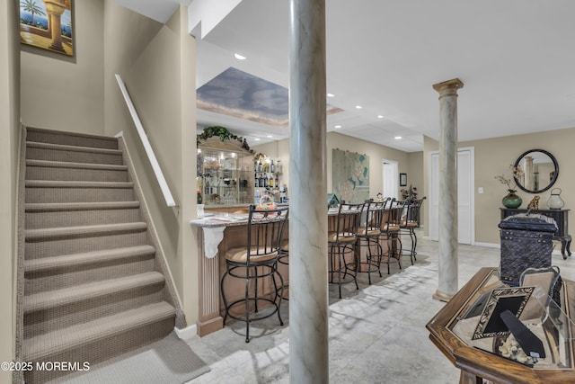 interior space with ornate columns and indoor bar