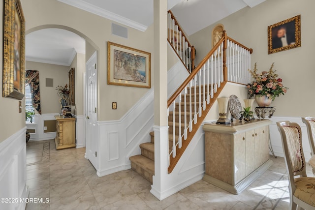 stairway featuring crown molding