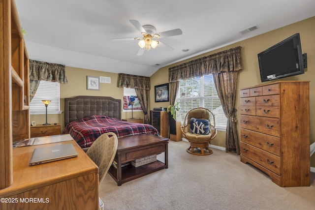 bedroom featuring ceiling fan, light colored carpet, and lofted ceiling