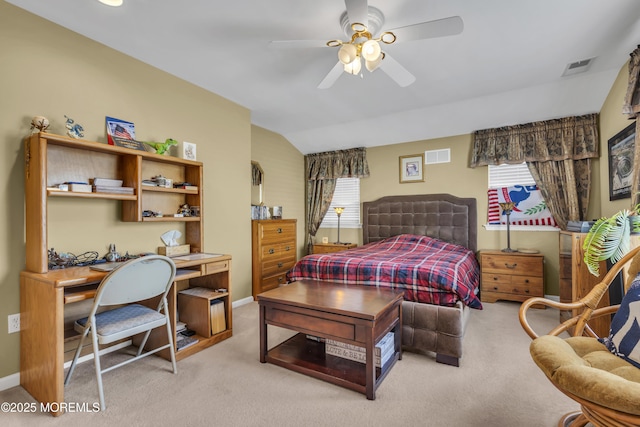 bedroom featuring ceiling fan, lofted ceiling, and light carpet