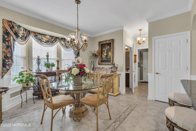 dining space featuring crown molding, plenty of natural light, and a chandelier