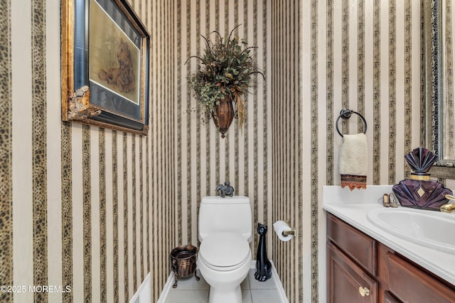 bathroom featuring tile patterned flooring, vanity, and toilet