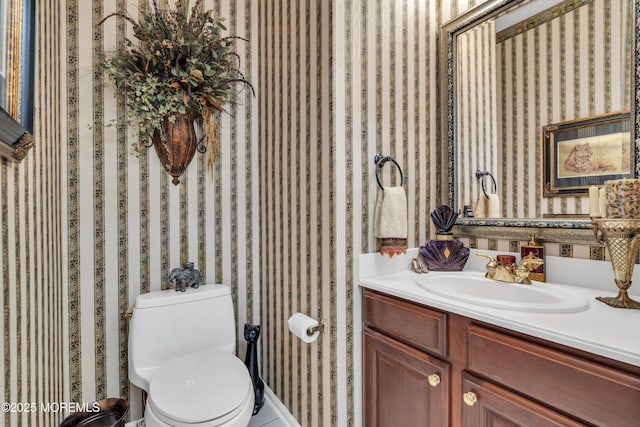 bathroom featuring vanity and toilet