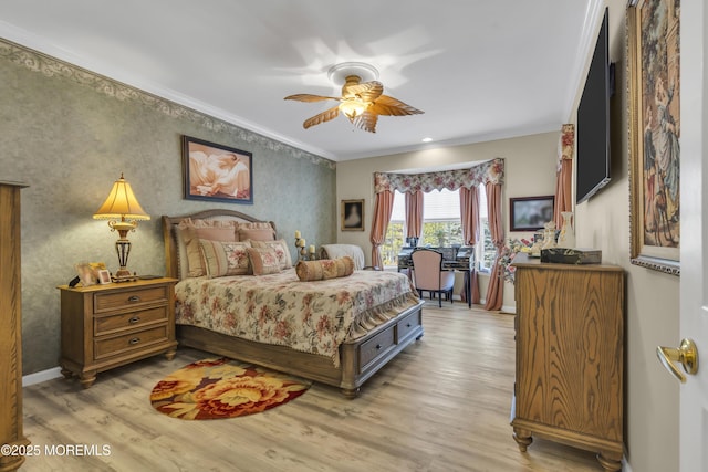 bedroom featuring ornamental molding, ceiling fan, and light hardwood / wood-style floors