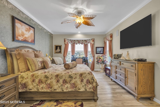 bedroom featuring ornamental molding, ceiling fan, and light wood-type flooring