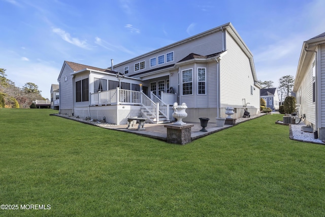 back of property with central AC unit, a lawn, and a sunroom