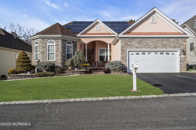106 Mission Way, Barnegat, NJ 08005 - view of front of property with a garage, covered porch, a front lawn, and solar panels