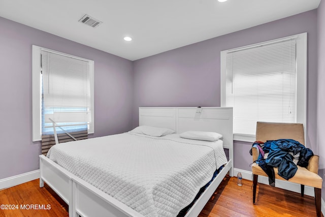 bedroom featuring wood-type flooring