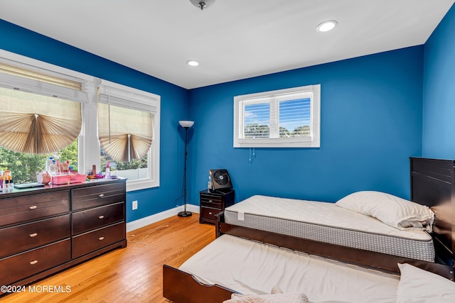 bedroom with light hardwood / wood-style floors