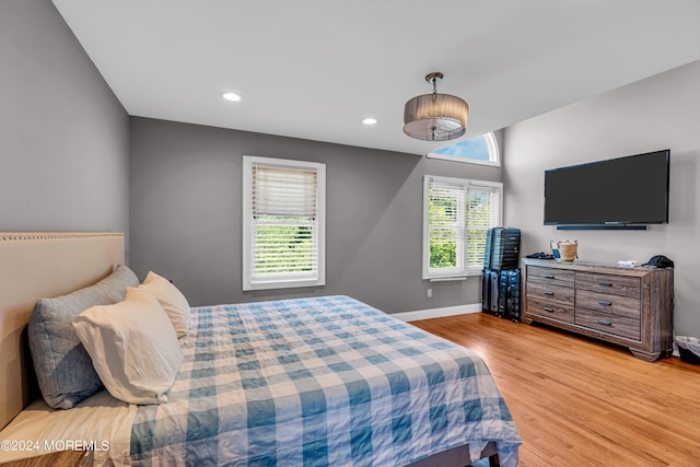 bedroom with light hardwood / wood-style flooring