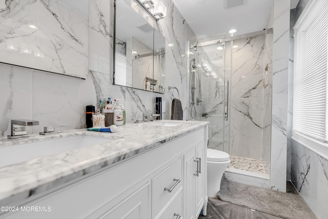 bathroom featuring vanity, tile walls, an enclosed shower, and toilet