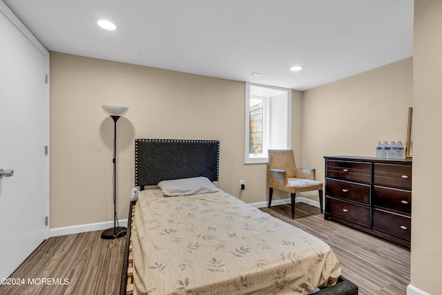 bedroom with light hardwood / wood-style floors