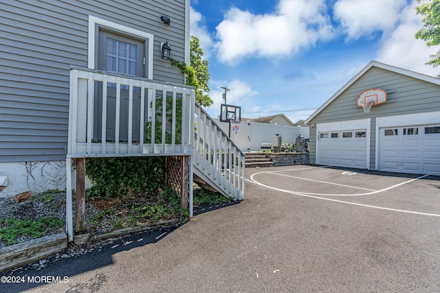 exterior space with an outdoor structure and basketball hoop