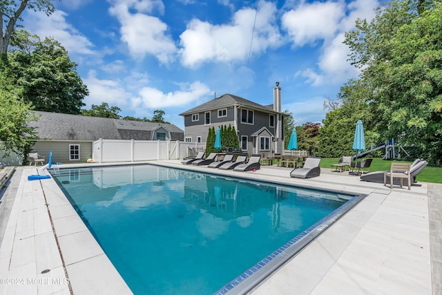 view of swimming pool with a patio area