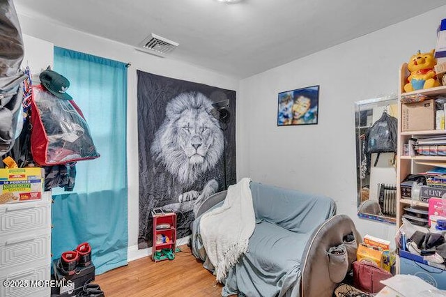 bedroom with wood-type flooring