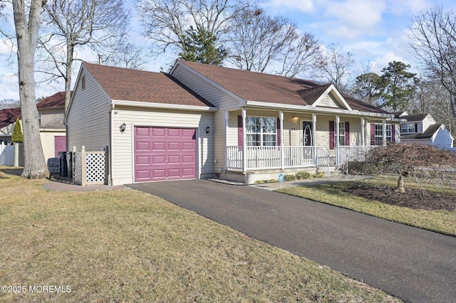 ranch-style home with a porch, a garage, and a front lawn