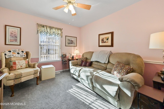 carpeted living room with ceiling fan