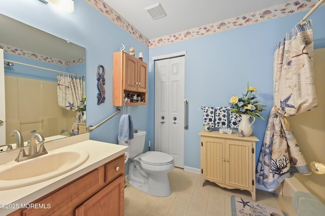 bathroom with vanity, toilet, and walk in shower