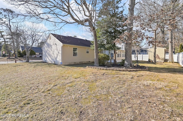 exterior space featuring a storage shed and a lawn