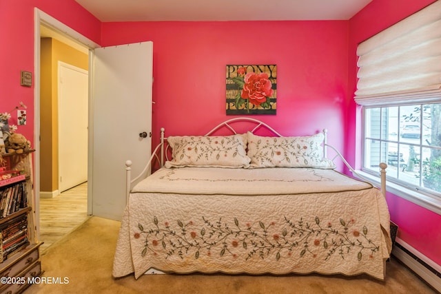 bedroom featuring a baseboard radiator and carpet