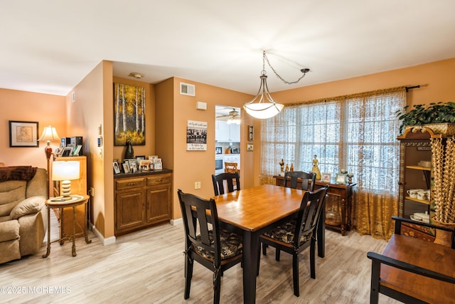 dining room with light hardwood / wood-style floors