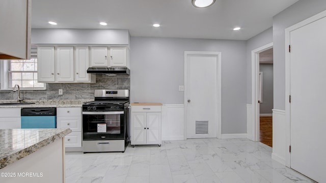 kitchen with visible vents, stainless steel gas stove, marble finish floor, under cabinet range hood, and dishwasher