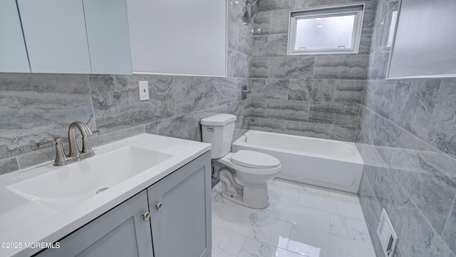 full bathroom featuring vanity, shower / washtub combination, tile walls, toilet, and marble finish floor